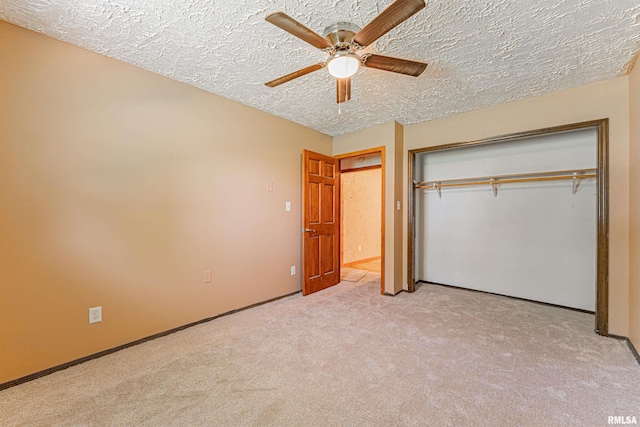 205 E Pine St, Broadwell, IL 62634 - unfurnished bedroom with light carpet, a closet, a textured ceiling, and ceiling fan