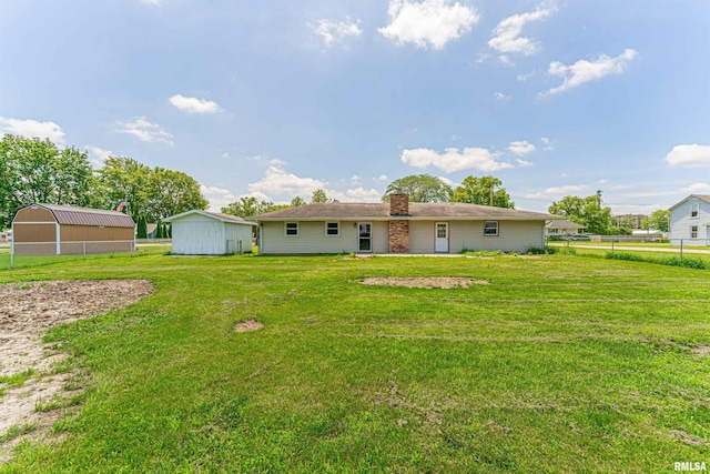 205 E Pine St, Broadwell, IL 62634 - back of house with a chimney