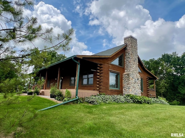 13570 Chambers Rd, Petersburg, IL 62675 - view of front of house with log exterior, a front yard, a chimney, and a porch