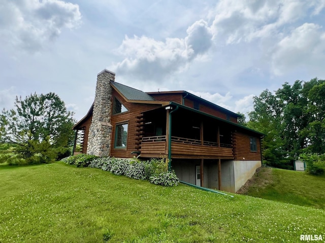 13570 Chambers Rd, Petersburg, IL 62675 - back of property featuring log siding, a lawn, a chimney, and a wooden deck