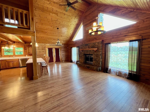 13570 Chambers Rd, Petersburg, IL 62675 - unfurnished living room with high vaulted ceiling, a wood ceiling with exposed beams, a chandelier, a ceiling fan, and a fireplace