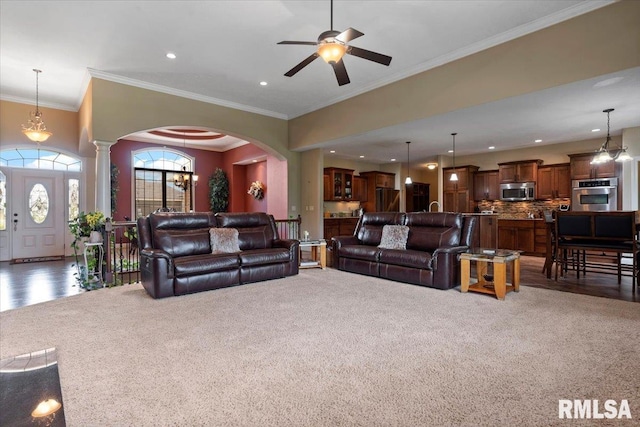 5408 Cromwell Pl, Springfield, IL 62711 - living room with carpet floors, arched walkways, ceiling fan, recessed lighting, and crown molding