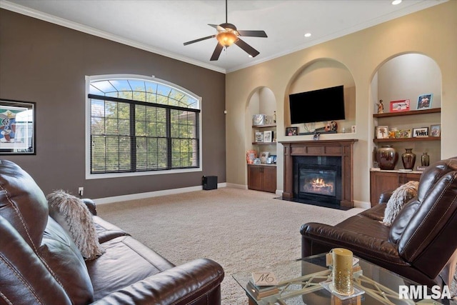 5408 Cromwell Pl, Springfield, IL 62711 - living room featuring carpet floors, ornamental molding, built in features, ceiling fan, and a fireplace with flush hearth