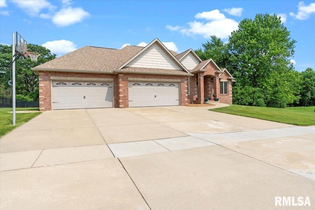 5408 Cromwell Pl, Springfield, IL 62711 - view of front facade featuring a garage, a front lawn, driveway, and brick siding