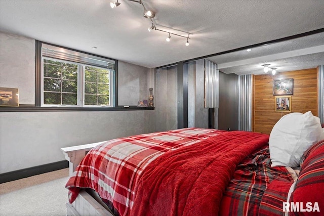5408 Cromwell Pl, Springfield, IL 62711 - carpeted bedroom with wooden walls and a textured ceiling
