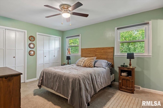 2 Mesa Rd, Springfield, IL 62702 - carpeted bedroom with two closets and a ceiling fan