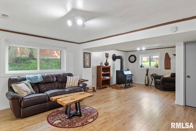 2 Mesa Rd, Springfield, IL 62702 - living room with a wood stove, light wood-style flooring, and crown molding