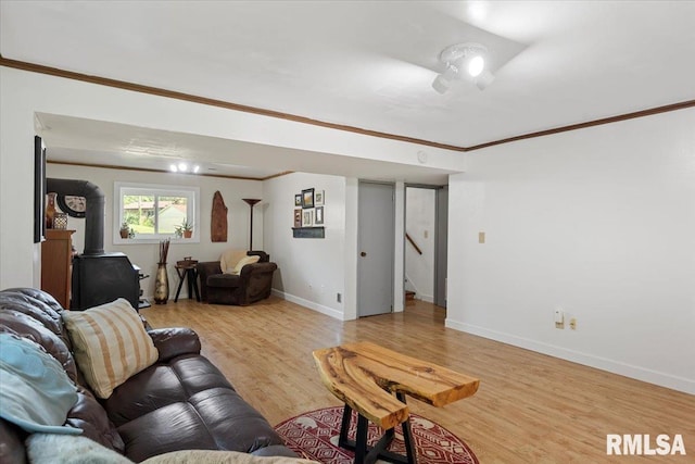 2 Mesa Rd, Springfield, IL 62702 - living room with wood finished floors, a wood stove, crown molding, and stairway