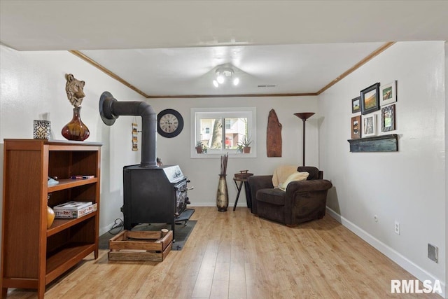 2 Mesa Rd, Springfield, IL 62702 - living area with a wood stove, ornamental molding, and wood finished floors