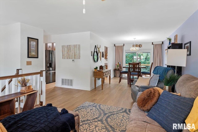 2 Mesa Rd, Springfield, IL 62702 - living room featuring light wood-style flooring and a chandelier