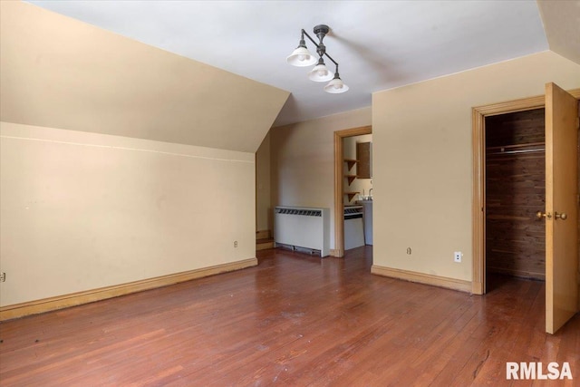 421 W Jackson Pkwy, Springfield, IL 62704 - additional living space featuring radiator, lofted ceiling, and wood finished floors