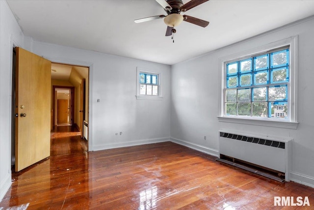 421 W Jackson Pkwy, Springfield, IL 62704 - unfurnished room featuring radiator heating unit, hardwood / wood-style flooring, a ceiling fan, and crown molding