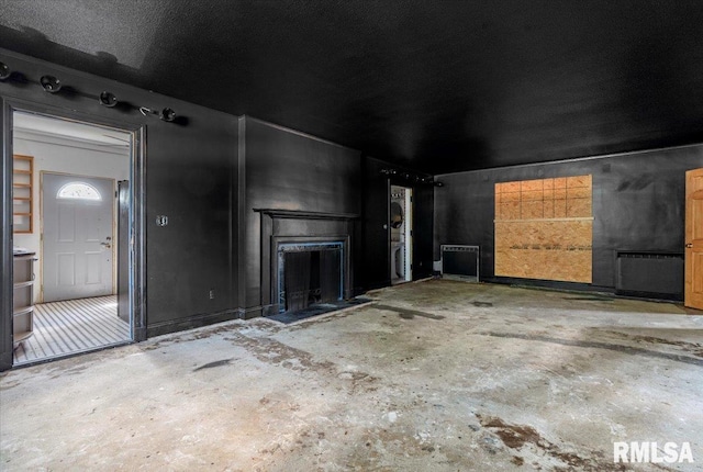 421 W Jackson Pkwy, Springfield, IL 62704 - unfurnished living room featuring concrete floors and a fireplace