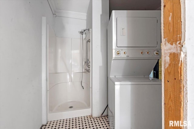 421 W Jackson Pkwy, Springfield, IL 62704 - bathroom with estacked washer and dryer, a shower stall, tile patterned floors, and crown molding