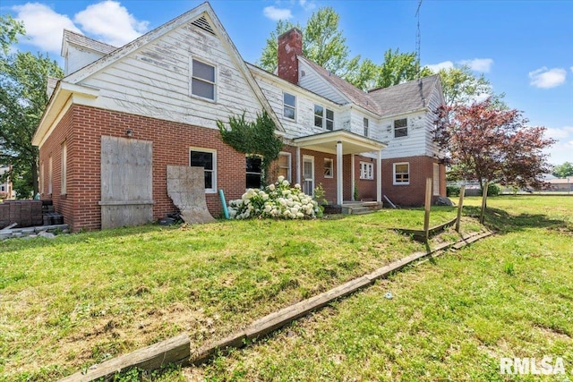 421 W Jackson Pkwy, Springfield, IL 62704 - view of front of property with a chimney, brick siding, and a front yard
