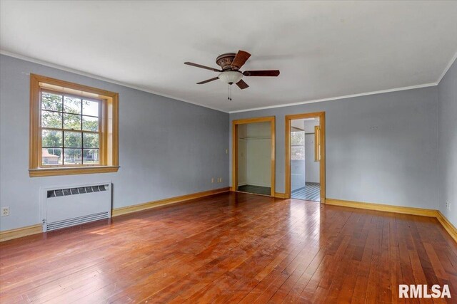 421 W Jackson Pkwy, Springfield, IL 62704 - unfurnished bedroom with radiator, crown molding, hardwood / wood-style flooring, and ceiling fan