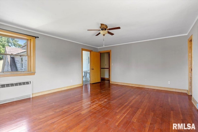 421 W Jackson Pkwy, Springfield, IL 62704 - spare room with radiator heating unit, ceiling fan, wood-type flooring, and crown molding
