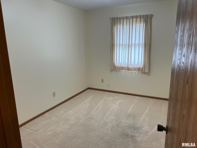 100 E Heights Ave, Taylorville, IL 62568 - spare room with light carpet and baseboards