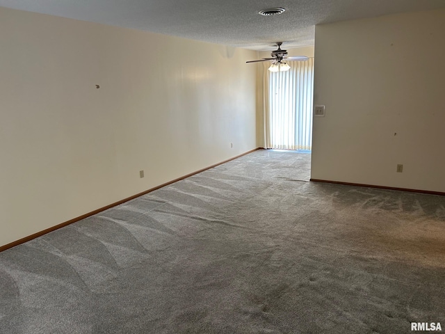 100 E Heights Ave, Taylorville, IL 62568 - unfurnished room featuring carpet flooring, a ceiling fan, and a textured ceiling