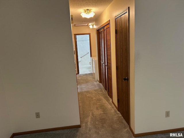 100 E Heights Ave, Taylorville, IL 62568 - hall featuring carpet floors and a textured ceiling