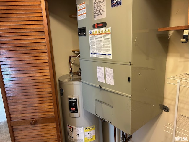 100 E Heights Ave, Taylorville, IL 62568 - utility room with heating unit and electric water heater