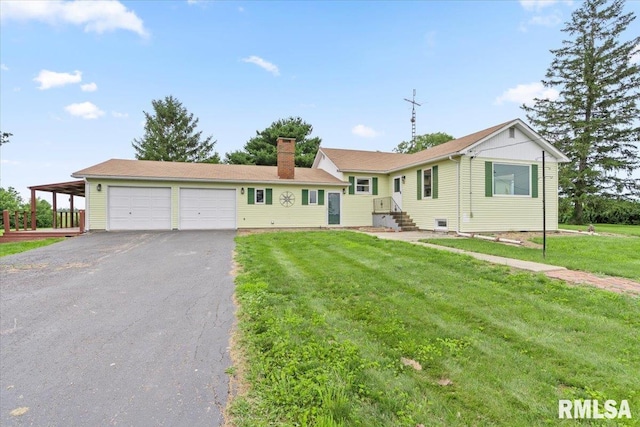 240 Mine Ave, Girard, IL 62640 - ranch-style home featuring a chimney, a garage, asphalt driveway, and a front yard