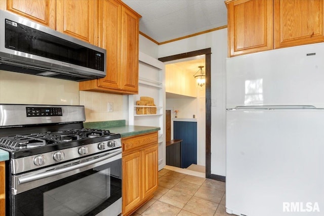 240 Mine Ave, Girard, IL 62640 - kitchen featuring appliances with stainless steel finishes, decorative backsplash, light tile patterned flooring, ornamental molding, and brown cabinetry