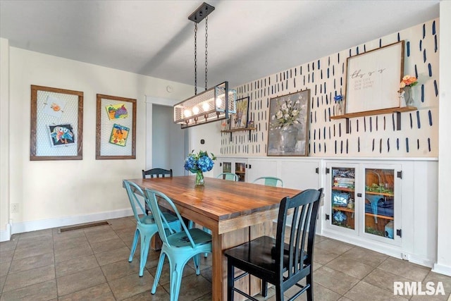 240 Mine Ave, Girard, IL 62640 - dining space featuring baseboards and tile patterned flooring