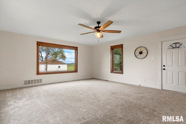 240 Mine Ave, Girard, IL 62640 - carpeted empty room with ceiling fan and baseboards