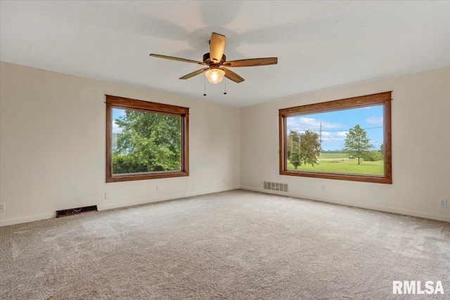 240 Mine Ave, Girard, IL 62640 - carpeted empty room with ceiling fan and baseboards