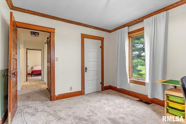 240 Mine Ave, Girard, IL 62640 - unfurnished bedroom featuring carpet flooring and crown molding