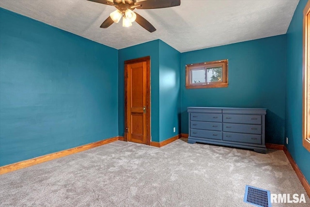240 Mine Ave, Girard, IL 62640 - unfurnished bedroom featuring carpet flooring and ceiling fan
