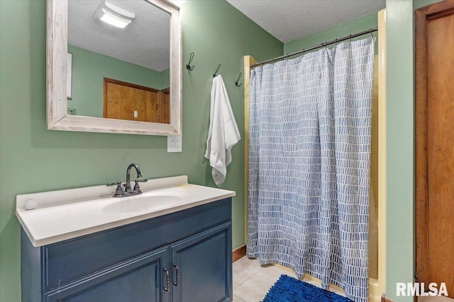 240 Mine Ave, Girard, IL 62640 - full bath with a textured ceiling, vanity, tile patterned floors, and a shower with shower curtain
