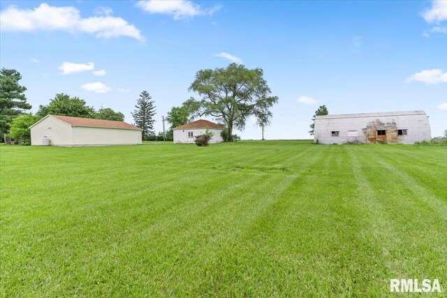 240 Mine Ave, Girard, IL 62640 - view of green lawn featuring an outbuilding and a barn