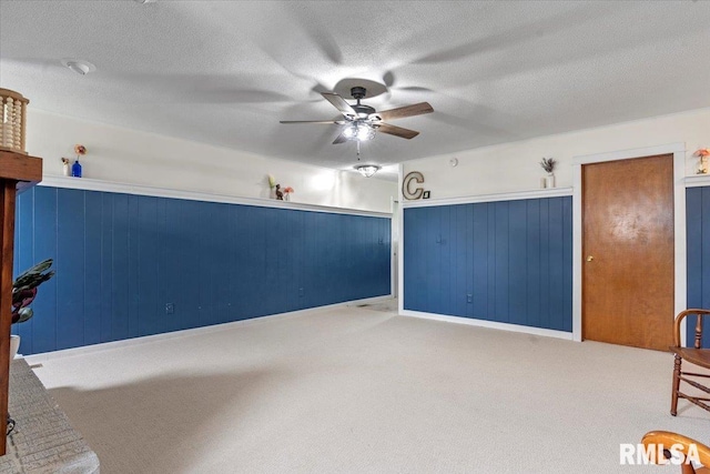 240 Mine Ave, Girard, IL 62640 - unfurnished living room with ceiling fan, carpet floors, and a textured ceiling
