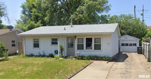 1513 Augusta St, Pekin, IL 61554 - view of front of home featuring an outdoor structure, a detached garage, a front yard, and concrete driveway