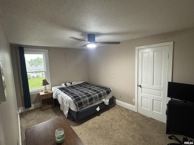 1238 N 12th St, Quincy, IL 62301 - carpeted bedroom with a textured ceiling and a ceiling fan