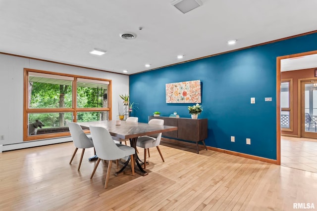 1847 New Salem Church Rd, New Berlin, IL 62670 - dining space featuring a baseboard radiator, crown molding, recessed lighting, and hardwood / wood-style floors