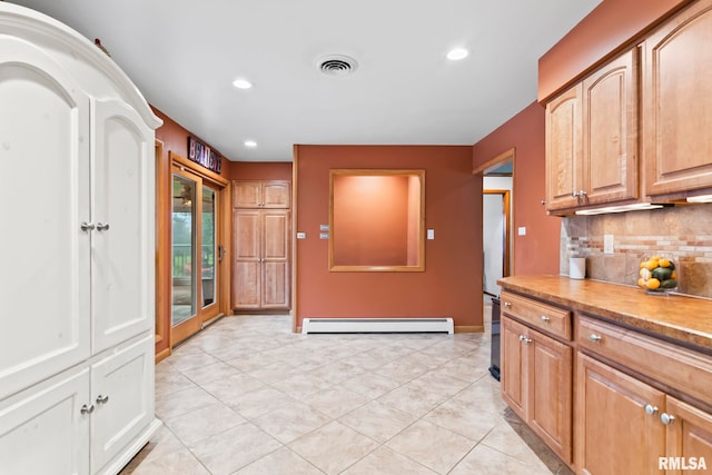 1847 New Salem Church Rd, New Berlin, IL 62670 - kitchen featuring a baseboard heating unit, tasteful backsplash, recessed lighting, light countertops, and light tile patterned floors
