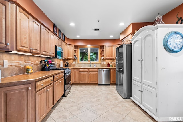 1847 New Salem Church Rd, New Berlin, IL 62670 - kitchen with appliances with stainless steel finishes, open shelves, tasteful backsplash, light tile patterned floors, and recessed lighting