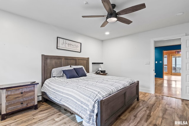 1847 New Salem Church Rd, New Berlin, IL 62670 - bedroom featuring light wood finished floors, recessed lighting, and ceiling fan