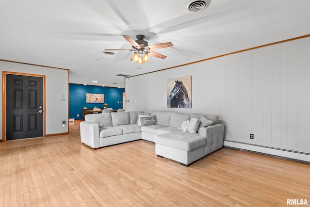 1847 New Salem Church Rd, New Berlin, IL 62670 - living area with baseboard heating, light wood-type flooring, ceiling fan, and crown molding