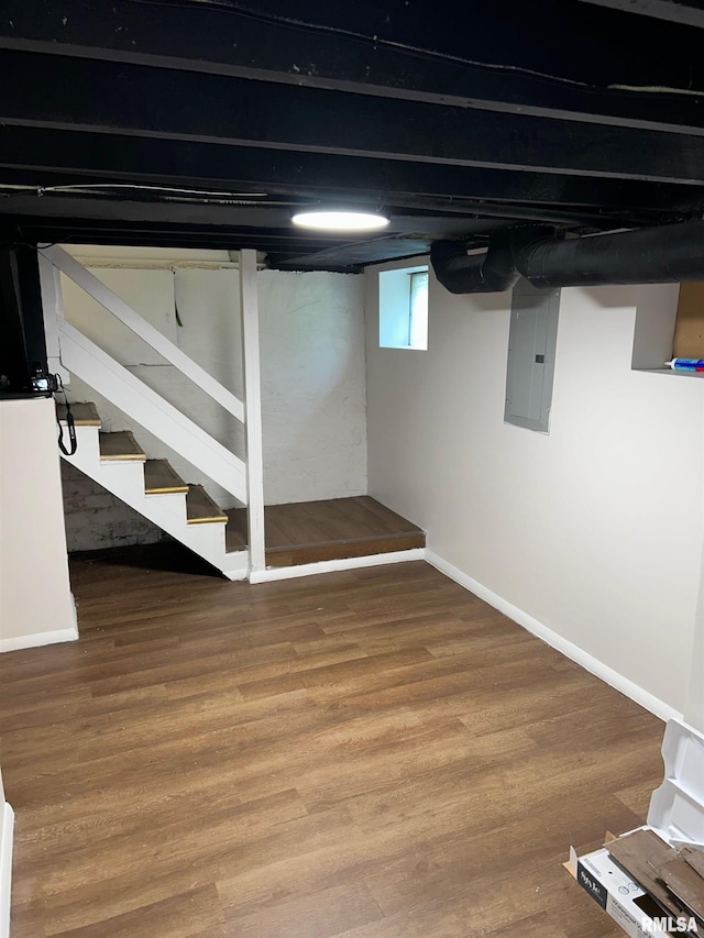 516 E Ash St, Springfield, IL 62703 - basement featuring electric panel, wood finished floors, and stairs