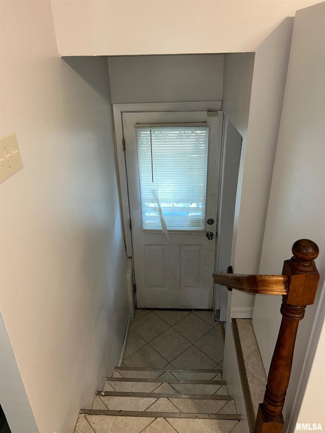 516 E Ash St, Springfield, IL 62703 - doorway with light tile patterned flooring and baseboards