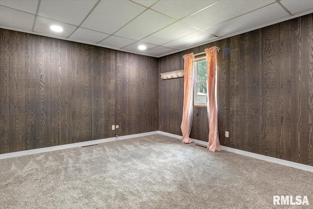 209 W Madison St, Athens, IL 62613 - carpeted spare room with recessed lighting, wooden walls, and a paneled ceiling