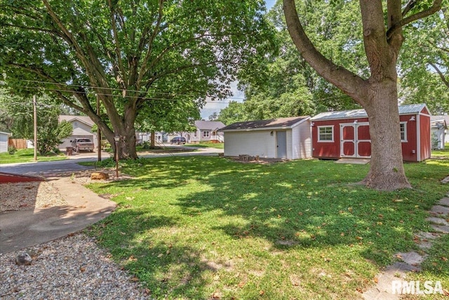 209 W Madison St, Athens, IL 62613 - view of grassy yard with a storage shed