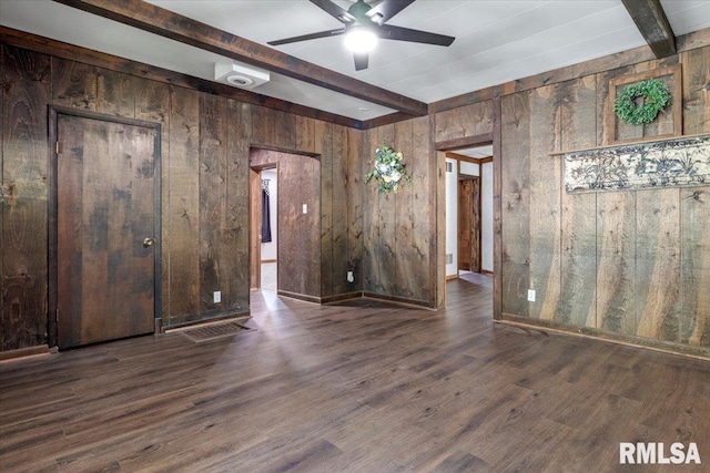 209 W Madison St, Athens, IL 62613 - unfurnished room featuring beamed ceiling, wooden walls, a ceiling fan, and wood finished floors