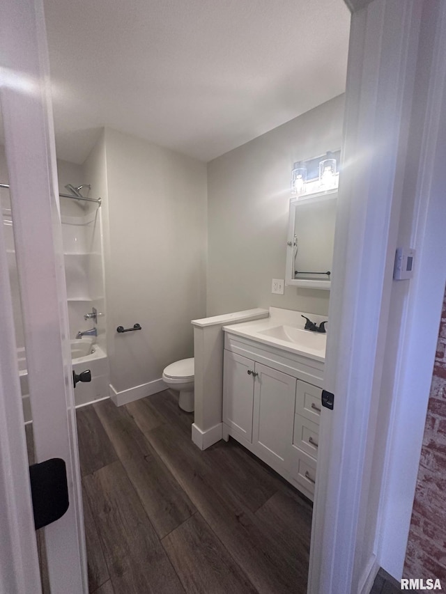 2016 Chestnut St, Quincy, IL 62301 - full bathroom with wood finished floors, vanity, and shower / washtub combination