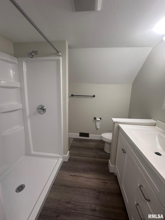 2016 Chestnut St, Quincy, IL 62301 - full bath featuring a stall shower, wood finished floors, vanity, and a textured ceiling