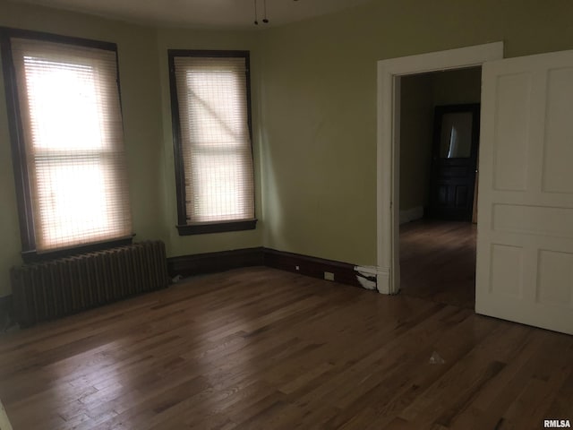 342 W Reynolds St, Springfield, IL 62702 - unfurnished room with radiator and wood finished floors